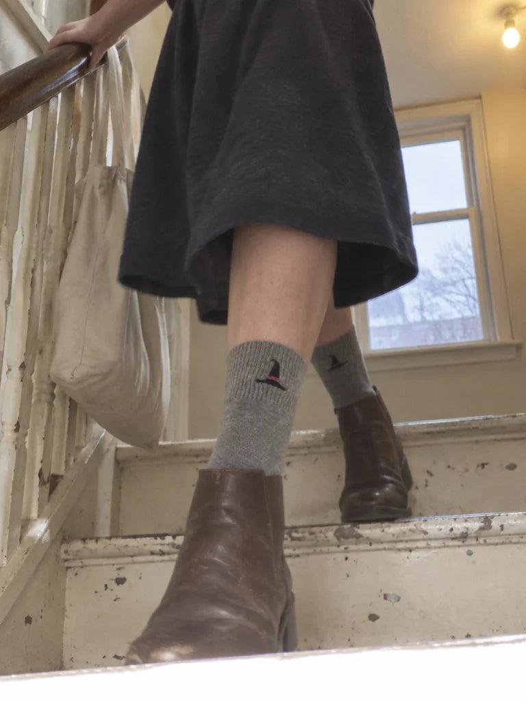 A customer's own photo, taken by a friend from one step below on an old residential stair: grey mid-